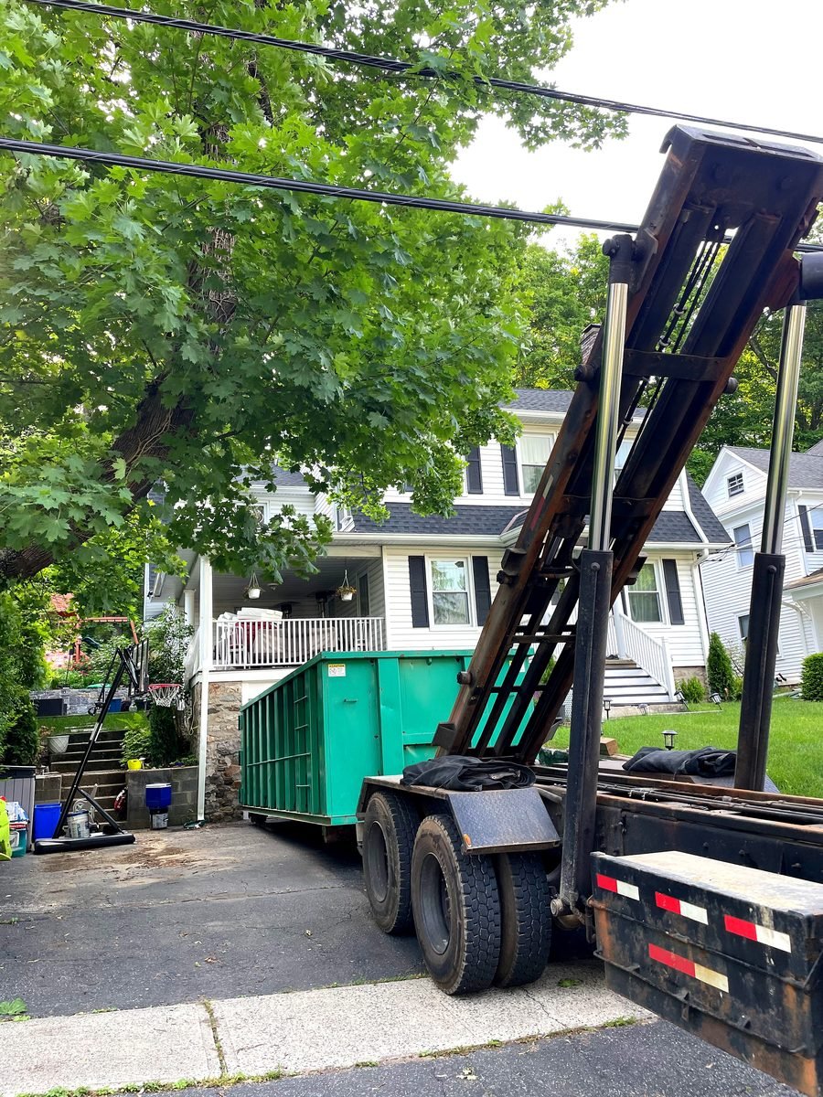 Treasure Valley Bin Co. roll-off container delivery on residential driveway in Boise